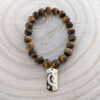 faceted_tigers-eye_celestial_charm_171_wood_bg faceted_tigers-eye_celestial_charm_171_wood_bg