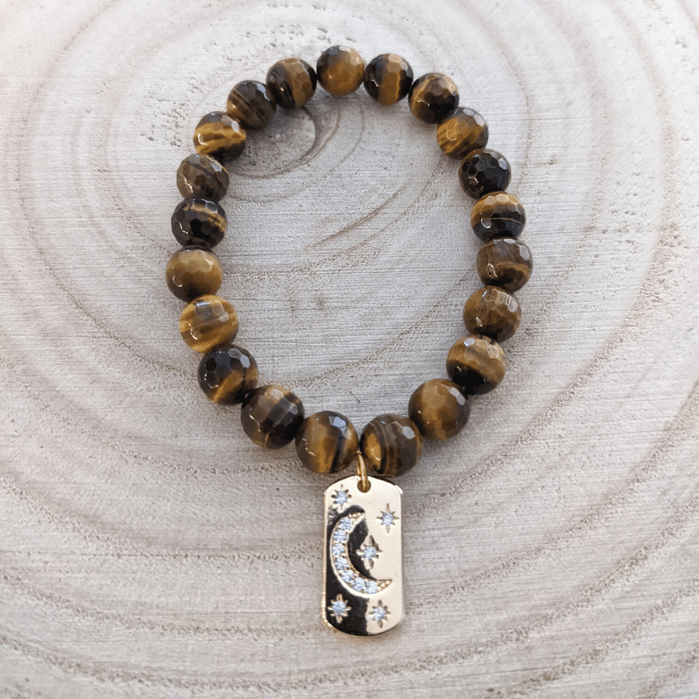 faceted_tigers-eye_celestial_charm_171_wood_bg